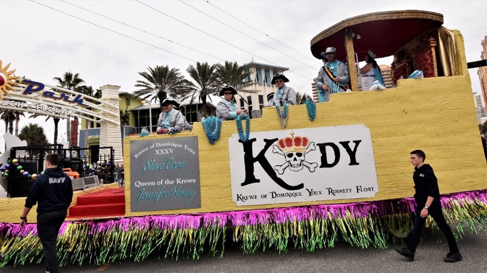 The current King & Queen ride in the back, sitting on Royal Thrones - Court parade Float Krewe of Dominique Youx Panama City
